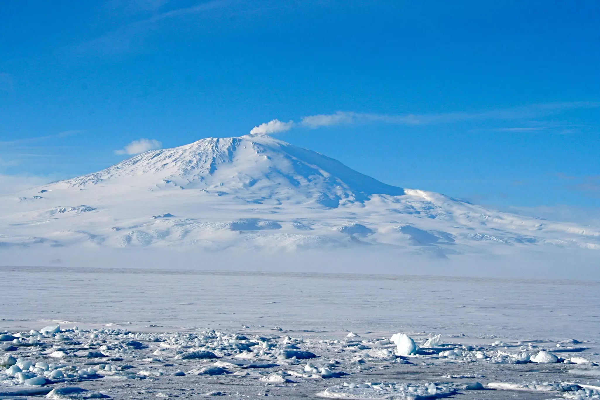 Snow-covered Mount Erebus, an active volcano in Antarctica