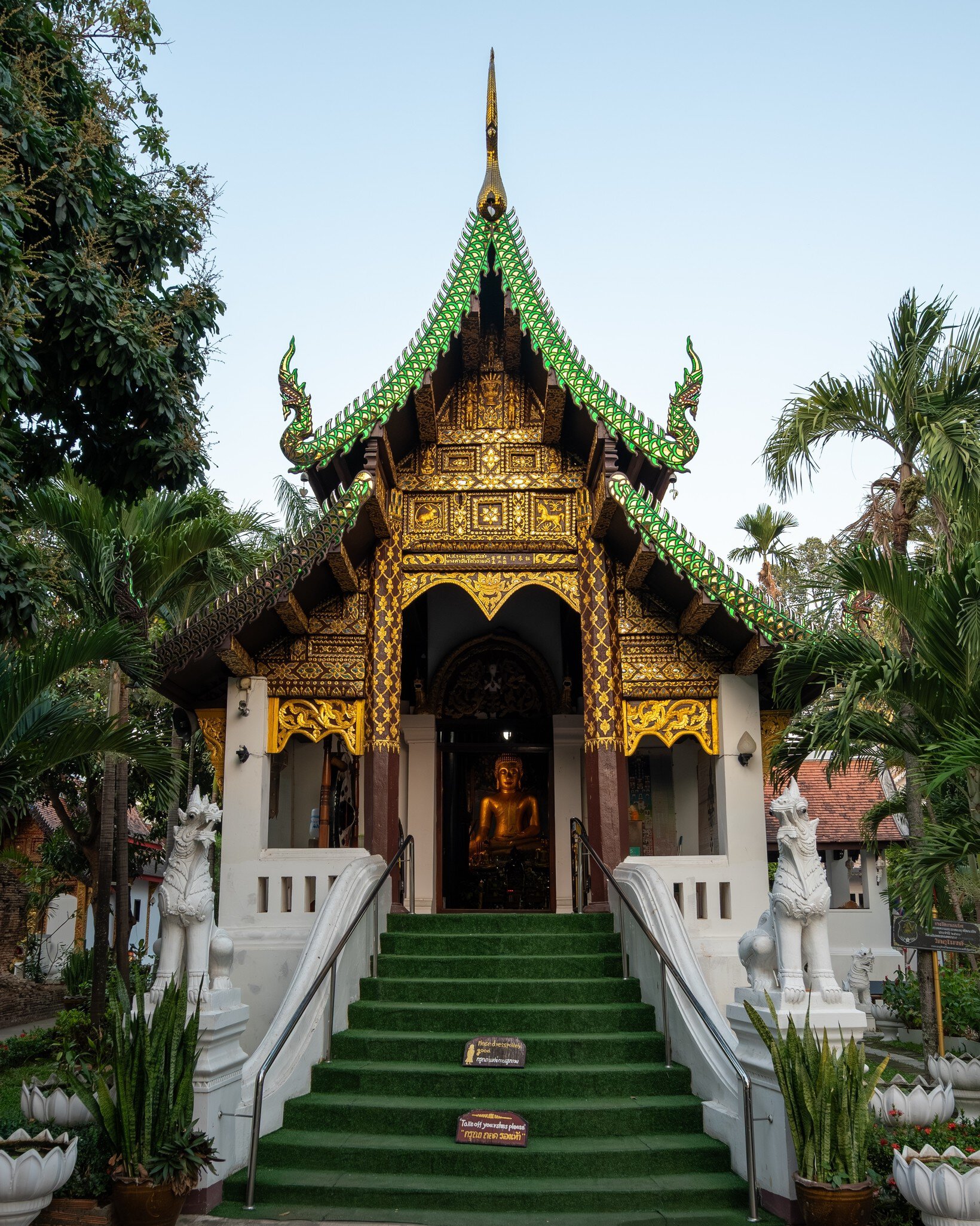 Chiang Mai, Thailand. The entrance pavilion of Wat Umong Mahathera Chan is seen with a Buddha statue inside.