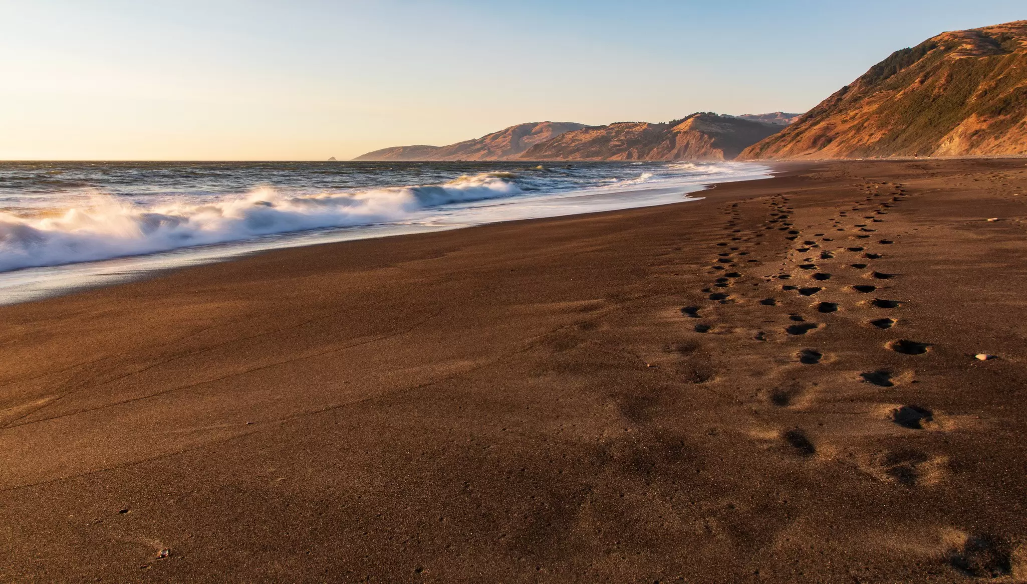 Mattole Beach with foot prints in sand near Petrolia at dusk on the Lost Coast Trail.