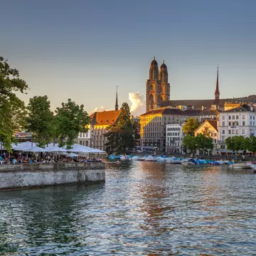 An iconic Limmat river view with Fraumünster and Grossmünster in the distance © Kirill Rudenko / Getty Images