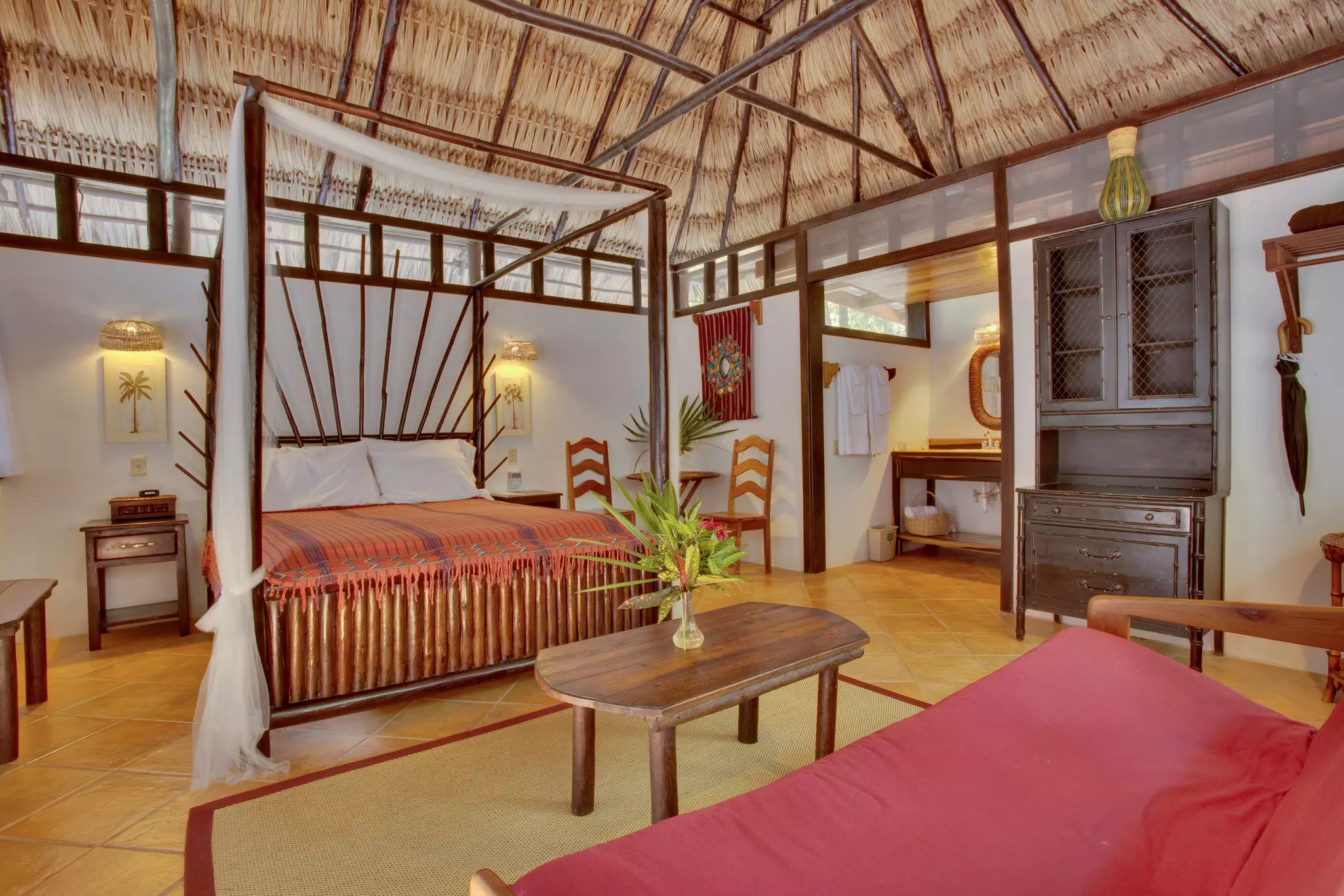 A room in a palm-thatched cabana at the Table Rock Jungle Lodge near San Ignacio, Belize.