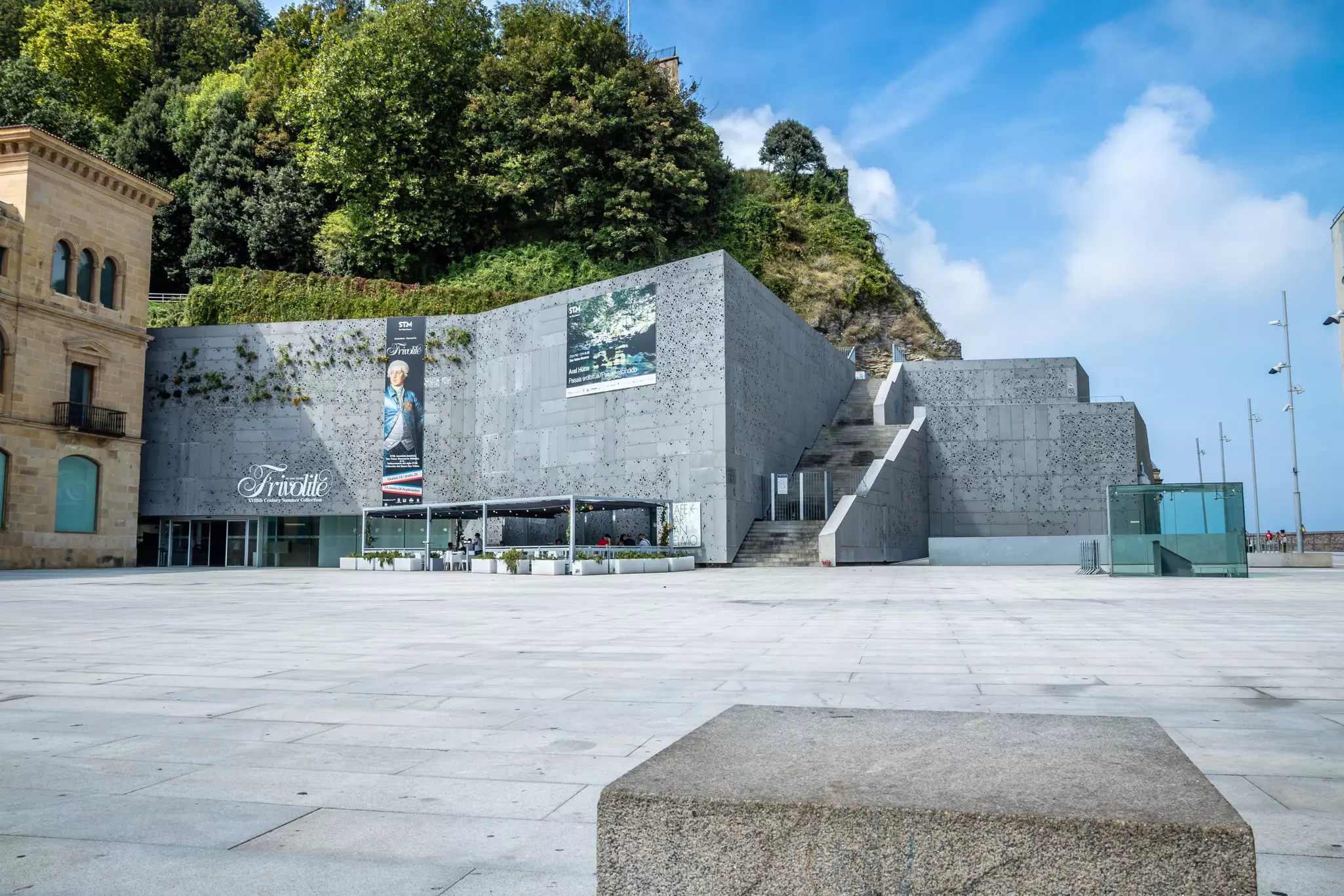 The exterior of a museum building built into a hillside.