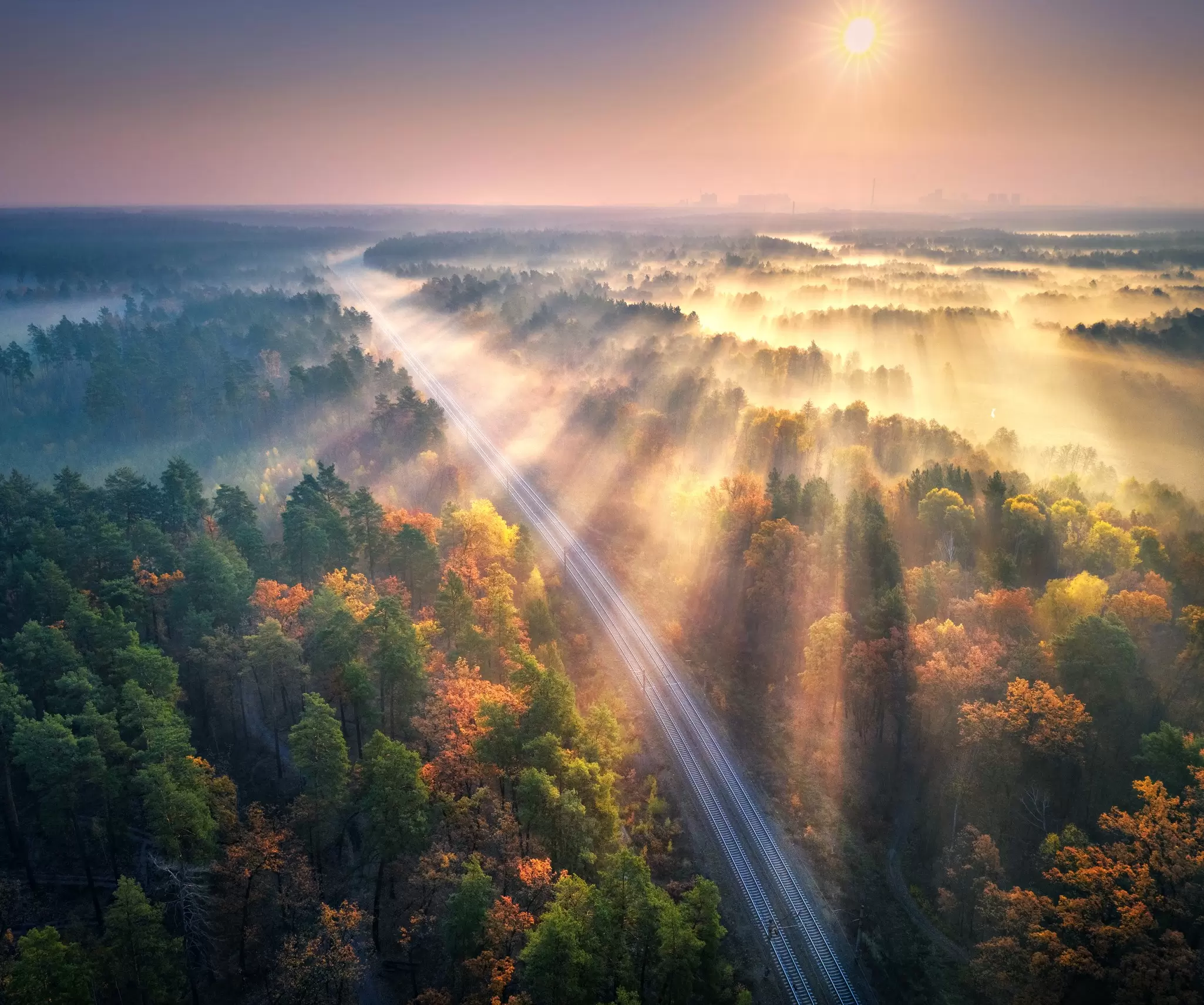 An Amtrak train passing through New England in autumn