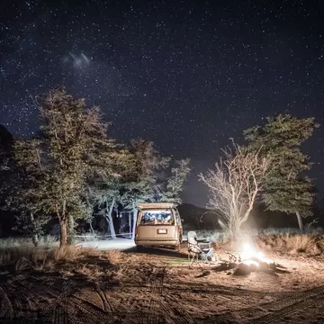 A campervan and fire under the stars at Cochise Stronghold camp in Arizona.
726772841
Arizona; Astronomy; AutotagHighlyAuthentic - Do Not Delete; Bare Tree; Camp; Campfire; Camping; Camping Chair; Cochise Stronghold; Color Image; Flame; Grass; Growth; Heat; Heat - Temperature; Horizontal; Illuminated; Illumination; Mode of Transport; Nature; Night; No People; Non-Urban Scene; Outdoor Chair; Outdoors; Photography; Scenics - Nature; Sky; Space and Astronomy; Star; Star - Space; Tranquility; Transportation; Tree; USA; Van;