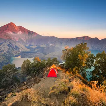 Tents pitched on the mountainous Senaru rim with Mount Rinjani (Anak Rinjani) in the background.
1286657365
adventure, asia, background, base camp, beautiful, blue, camp, campsite, century, cloud, crater, forest, green, gunung, hiking, hill, indonesia, island, lake, landscape, lombok, mount, mountain, national, nature, outdoor, park, picture, plawangan, rim, rinjani, scenic, season, senaru, sky, sport, summer, sunrise, sunset, tent, top, tourism, travel, tree, trekking, tropical, view, volcano, water, wilderness