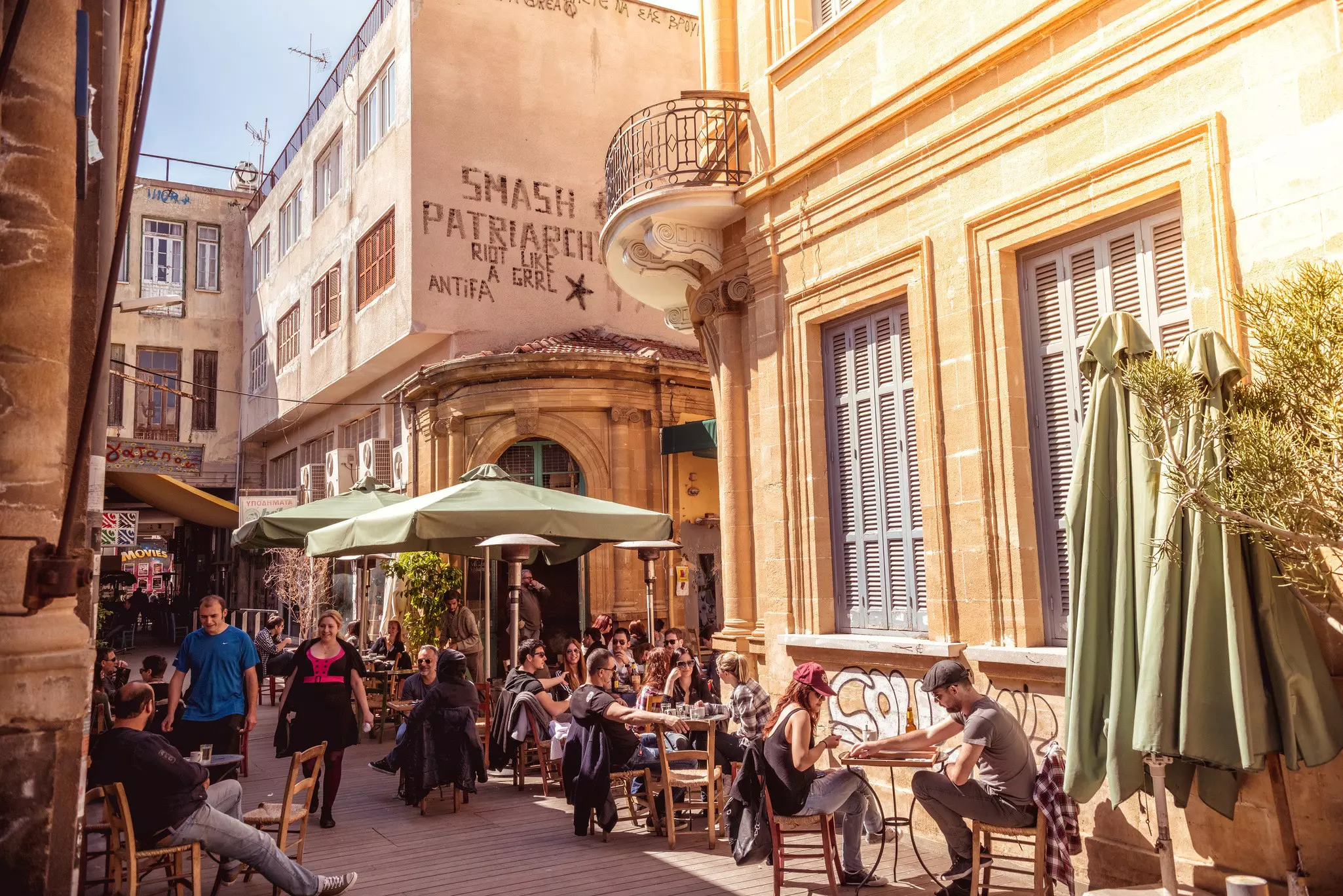 People in restaurants and coffee shops in the old part of Nicosia