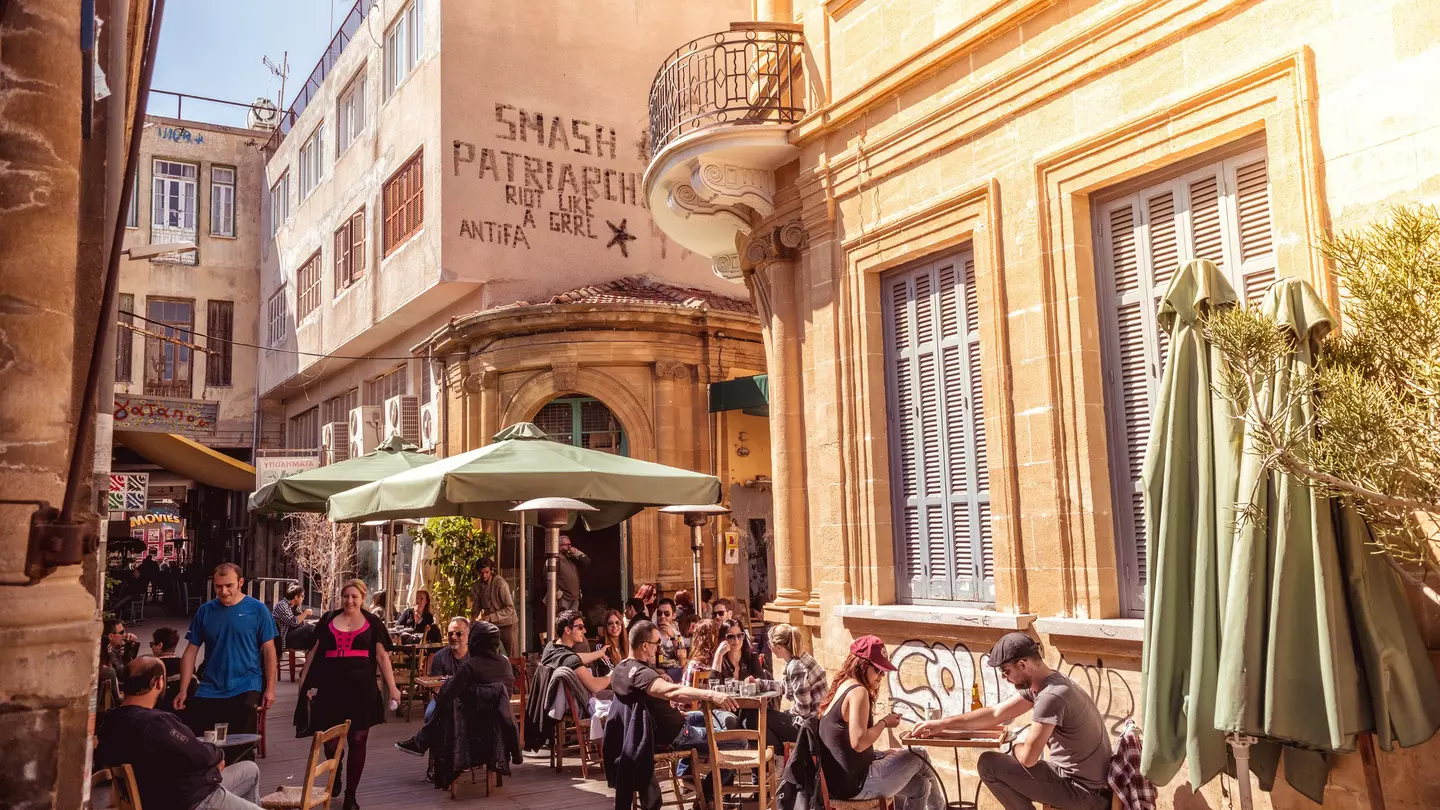 People in restaurants and coffee shops in the old part of Nicosia