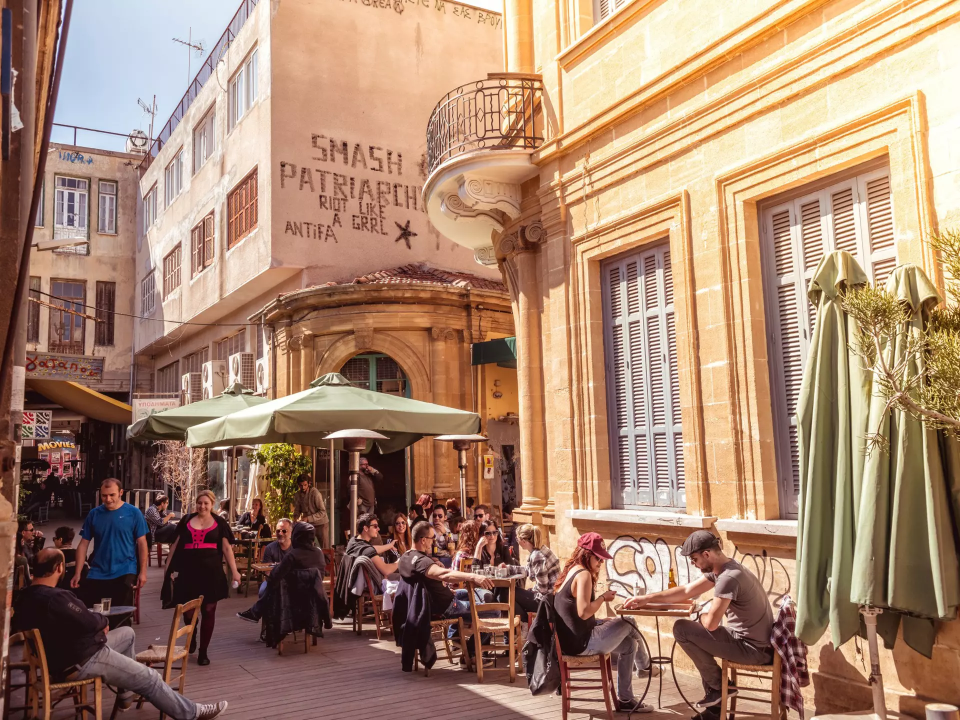 People in restaurants and coffee shops in the old part of Nicosia