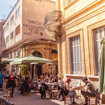People in restaurants and coffee shops in the old part of Nicosia