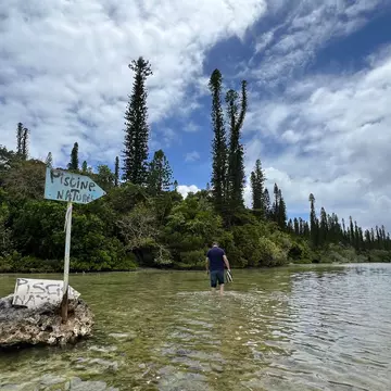 ÎLES DES PINS, NEW CALEDONIA, DECEMBER 2025. Walking to the Natural Swimming Pool on the Isle of Pines.