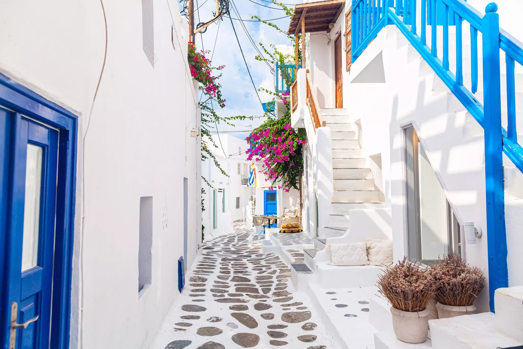 Mykonos island, Greece. Famous old town narrow street with white houses, License Type: media, Download Time: 2025-01-24T21:50:41.000Z, User: katelyn.perry_lonelyplanet, Editorial: false, purchase_order: 65050 - Digital Destinations and Articles, job: Lonely Planet WiP, client: Lonely Planet WiP, other: Katelyn Perry