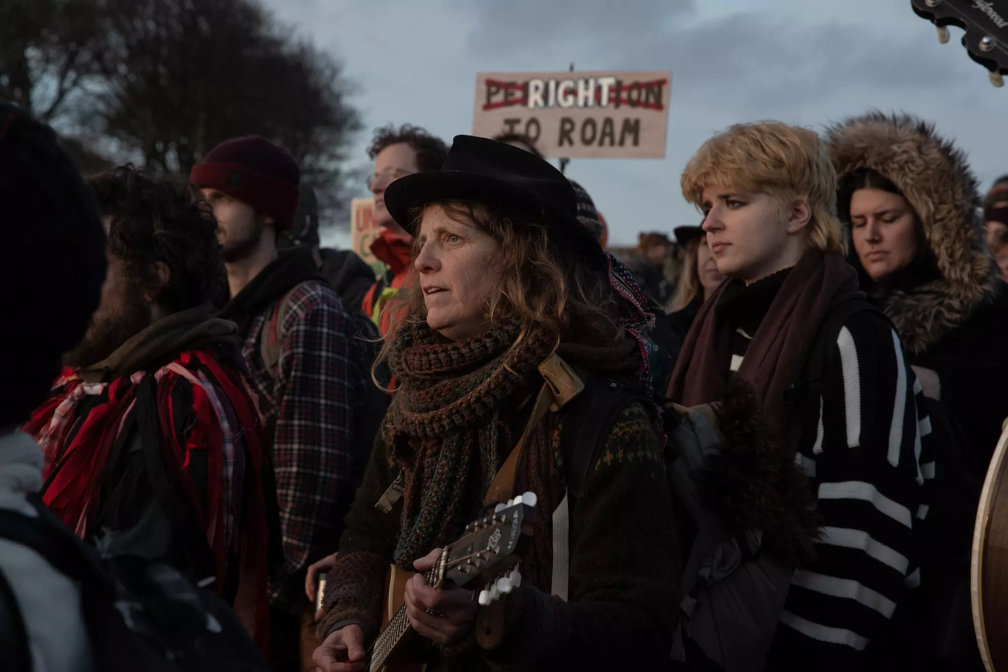 Performers sing and dance at Dartmoor National Park in January 2023, protesting the now-overturned ban on wild camping © Jonny Pickup/Getty Images