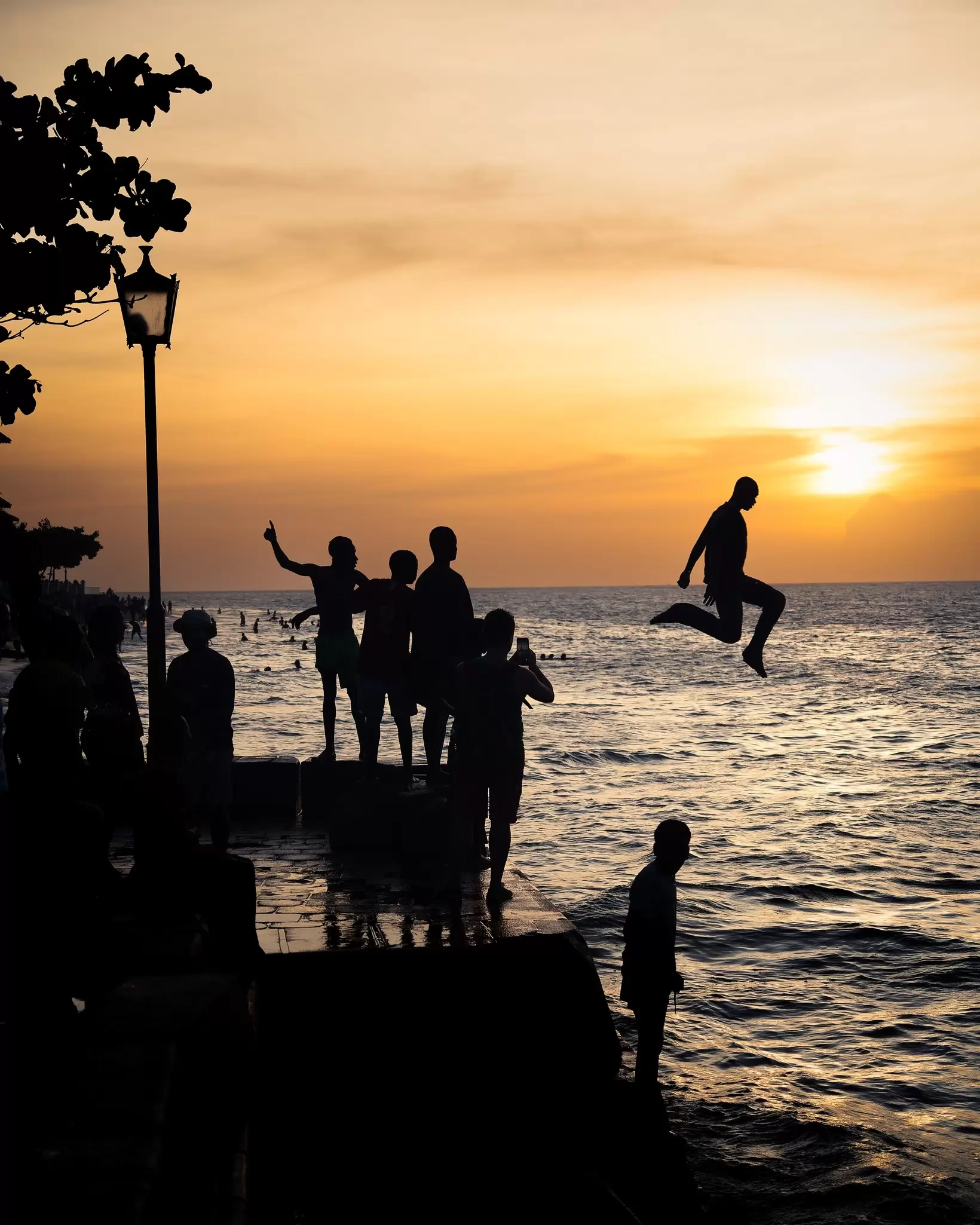 Stone Town, Tanzania - January 2023 : Divers at sunset, License Type: media, Download Time: 2025-01-30T02:44:15.000Z, User: Ppeterson948, Editorial: true, purchase_order: 56530 - Guidebooks, job: Global Publishing WIP, client: Global Publishing WIP, other: Pia Peterson Haggarty