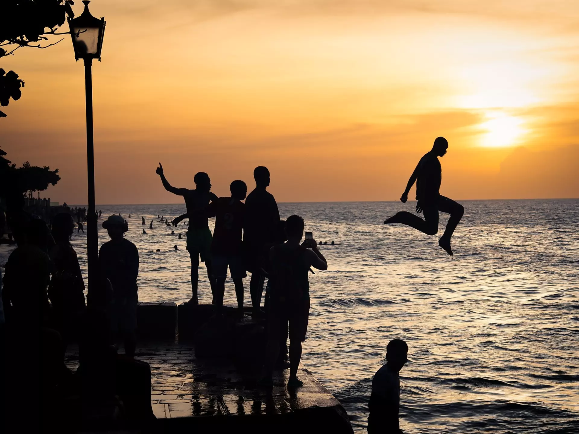 Stone Town, Tanzania - January 2023 : Divers at sunset, License Type: media, Download Time: 2025-01-30T02:44:15.000Z, User: Ppeterson948, Editorial: true, purchase_order: 56530 - Guidebooks, job: Global Publishing WIP, client: Global Publishing WIP, other: Pia Peterson Haggarty