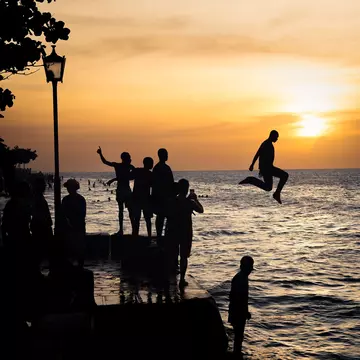 Stone Town, Tanzania - January 2023 : Divers at sunset, License Type: media, Download Time: 2025-01-30T02:44:15.000Z, User: Ppeterson948, Editorial: true, purchase_order: 56530 - Guidebooks, job: Global Publishing WIP, client: Global Publishing WIP, other: Pia Peterson Haggarty