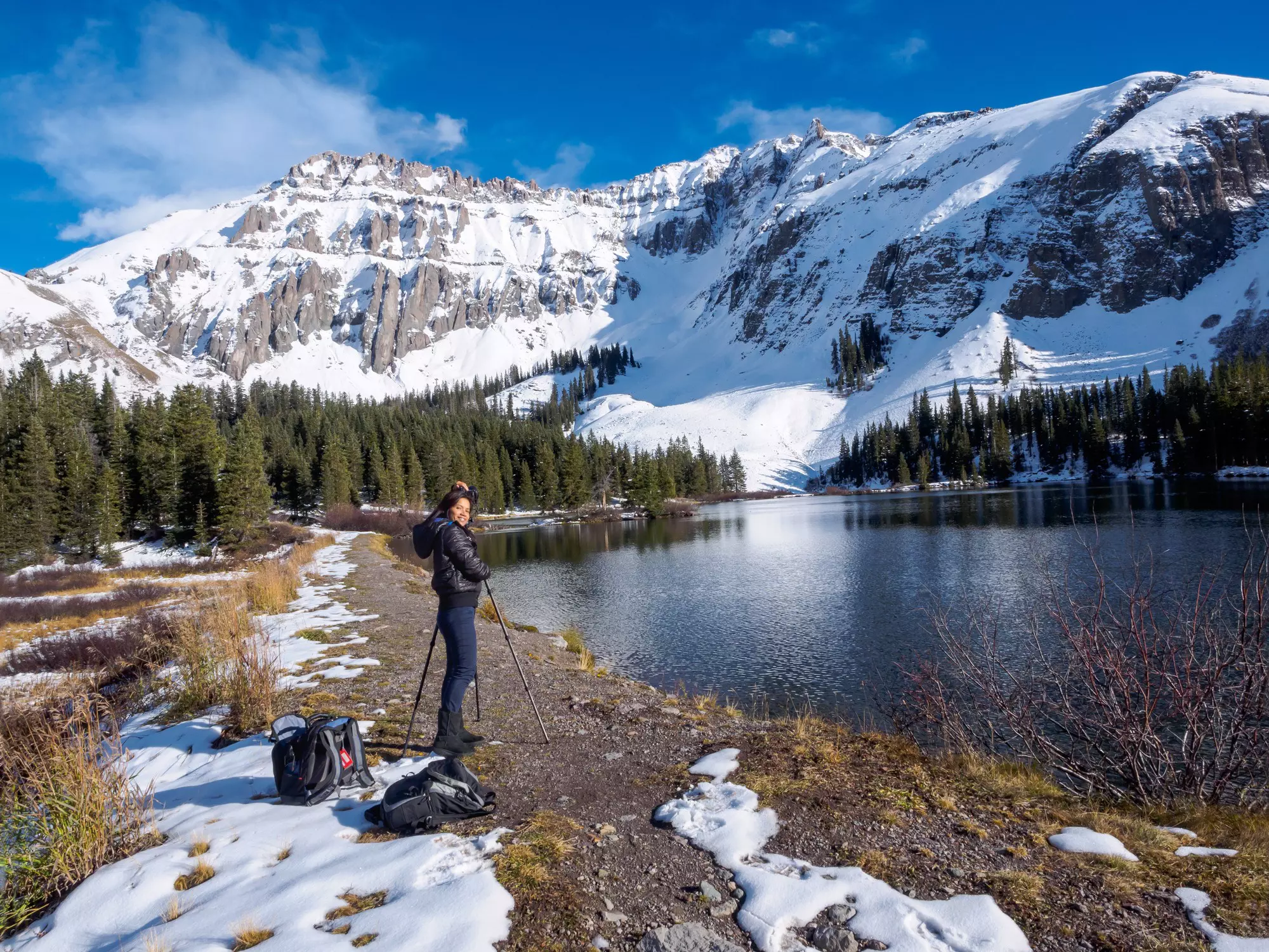 A late-winter hiker making the most of the photography opportunities near Telluride, Colorado. YayaErnst/Getty Images