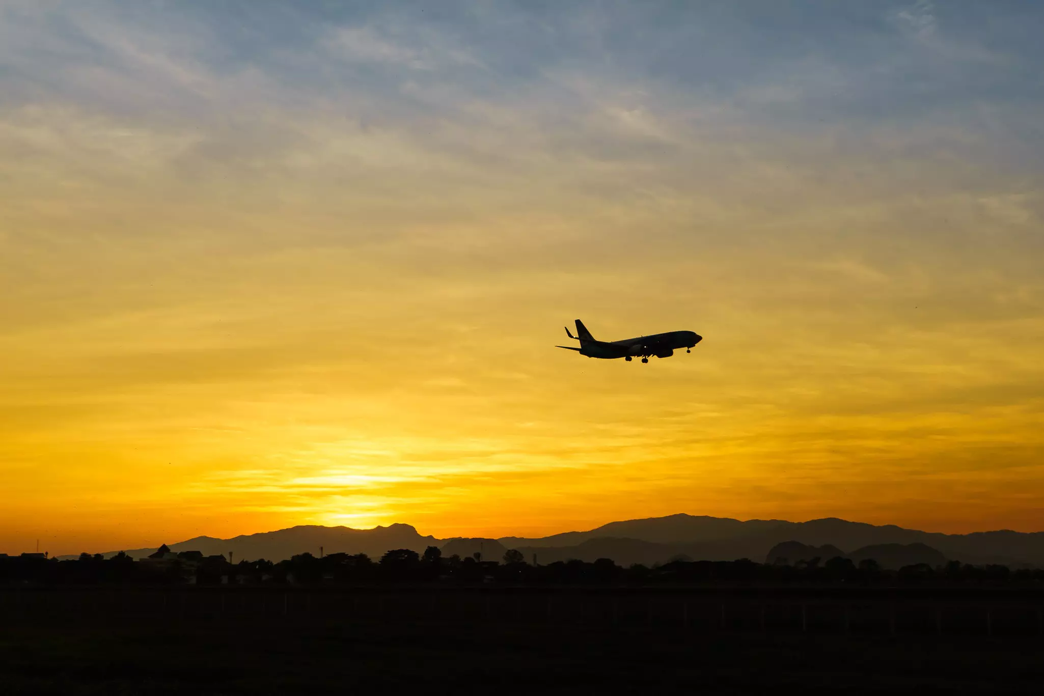 Horizon at sunset with aeroplane.