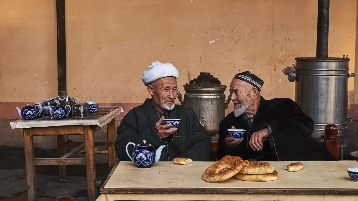 Uzbek men in a chaikhana (traditional tea house) in Kokand, Fergana Valley, Uzbekistan.