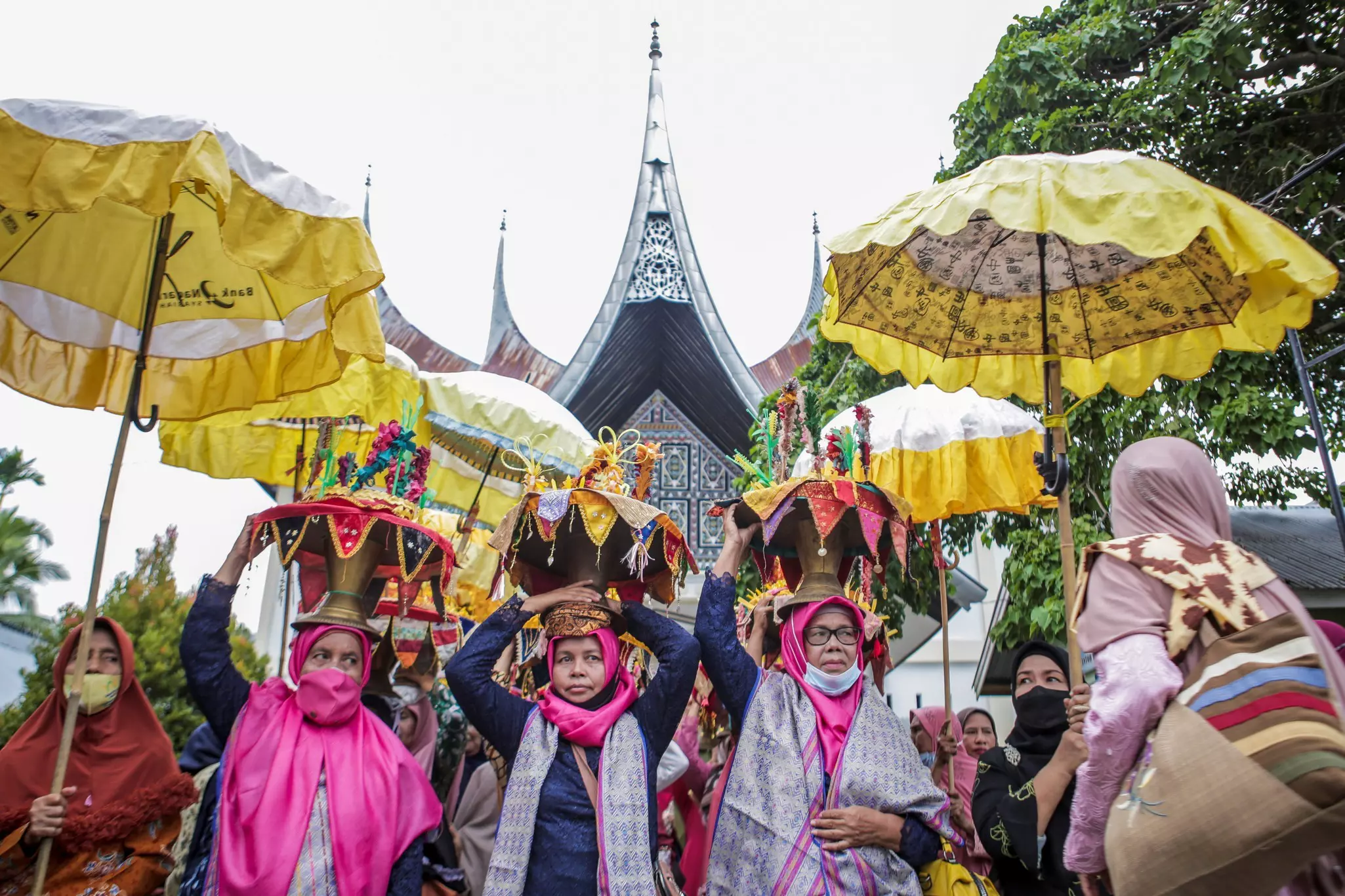 A volcanic crater is filled with blue water surrounded by a mountain.