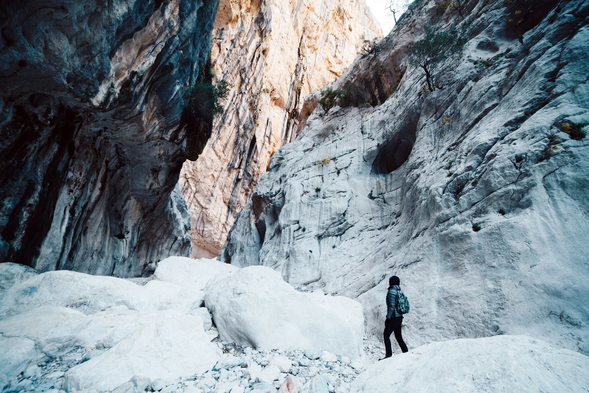 Woman hiking inside the deepest canyon in Europe - Activity and Health concept - Gola Su Gorroppu.