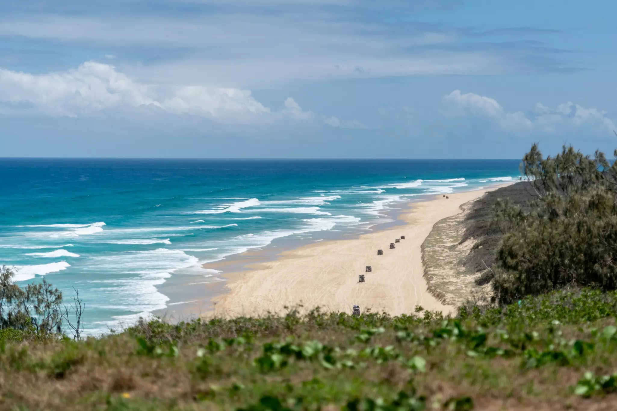Hit the sandy highway in a 4WD on K'gari, where 75-Mile Beach awaits © wallix / Getty Images