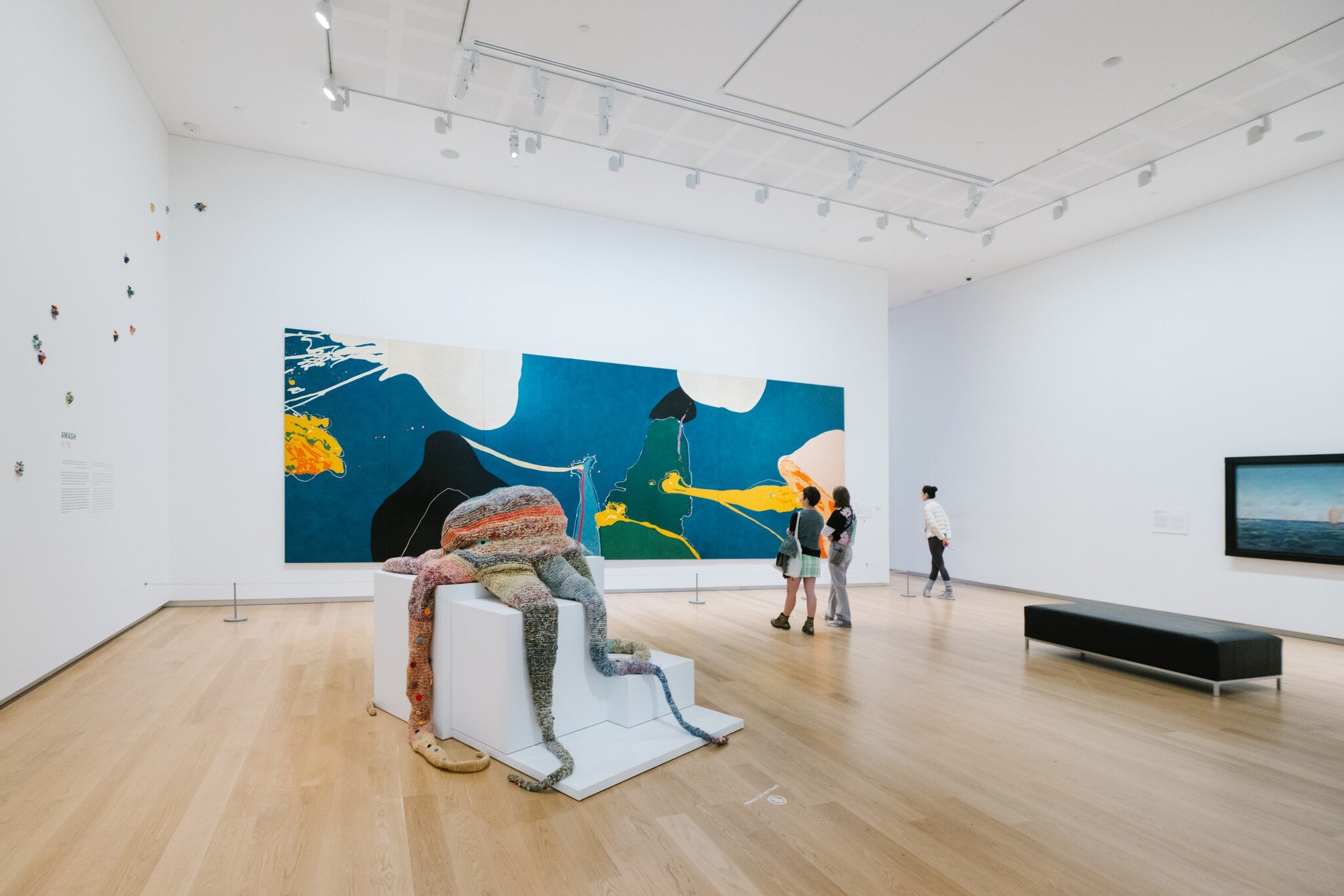People admiring the artwork at the Auckland Art Gallery Toi o Tāmaki in Auckland, New Zealand.