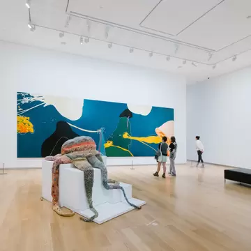 People admiring the artwork at the Auckland Art Gallery Toi o Tāmaki in Auckland, New Zealand.
