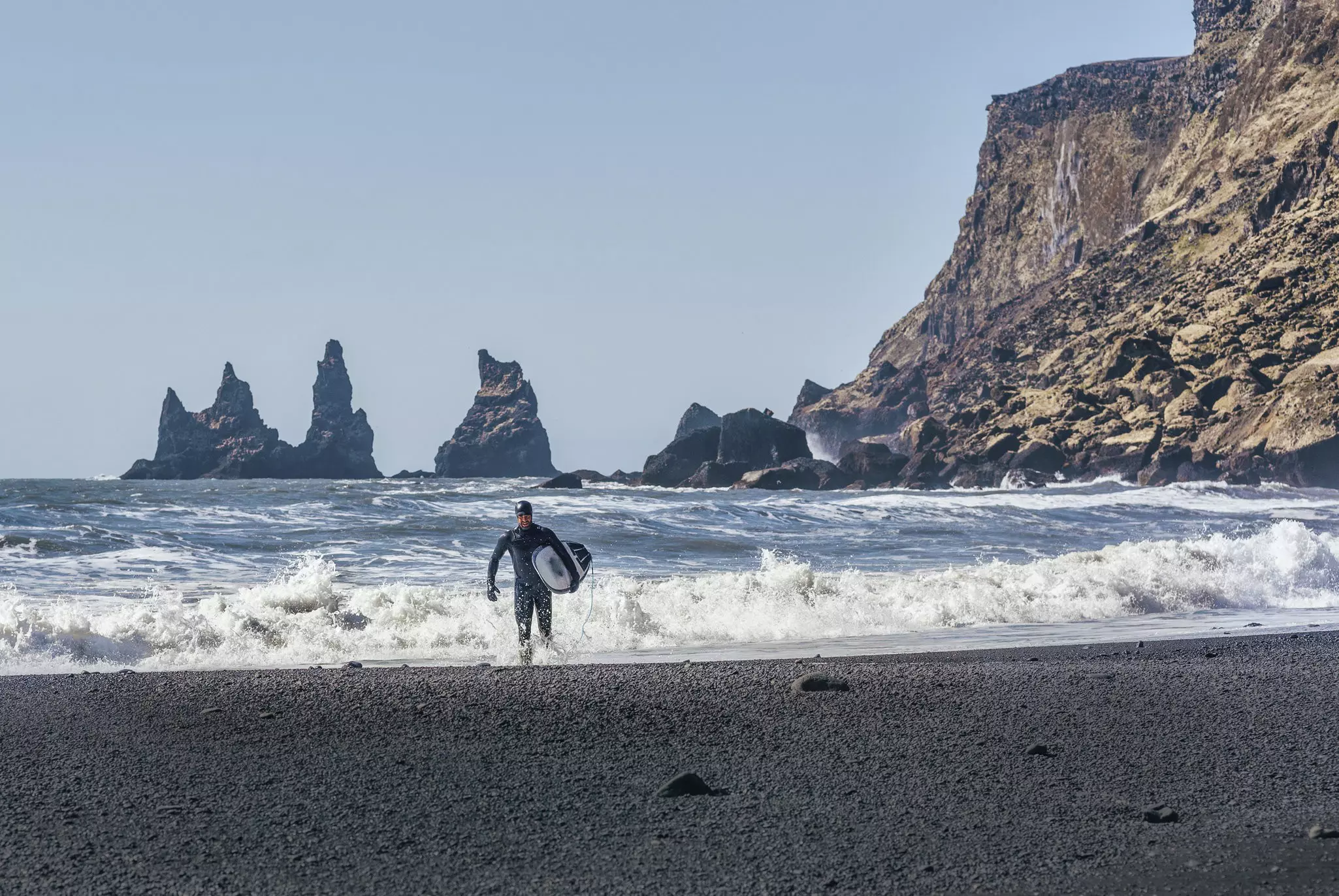 Arctic surfing is possible off the black sand beaches of Sandvik in southern Iceland. Cavan Images / Getty Images