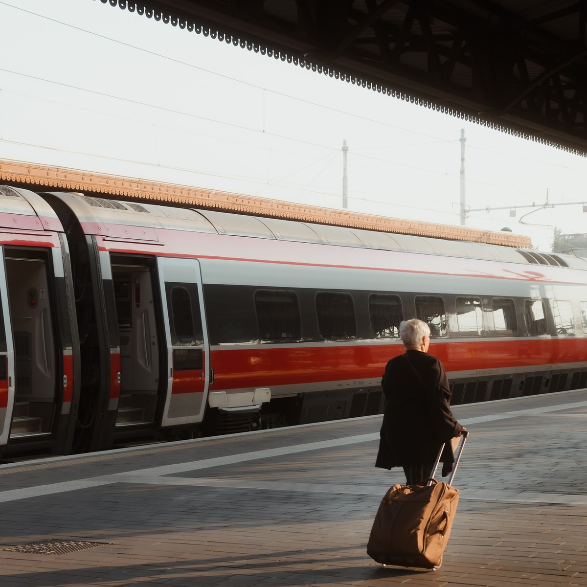 A traveler and suitcase, Verona train station