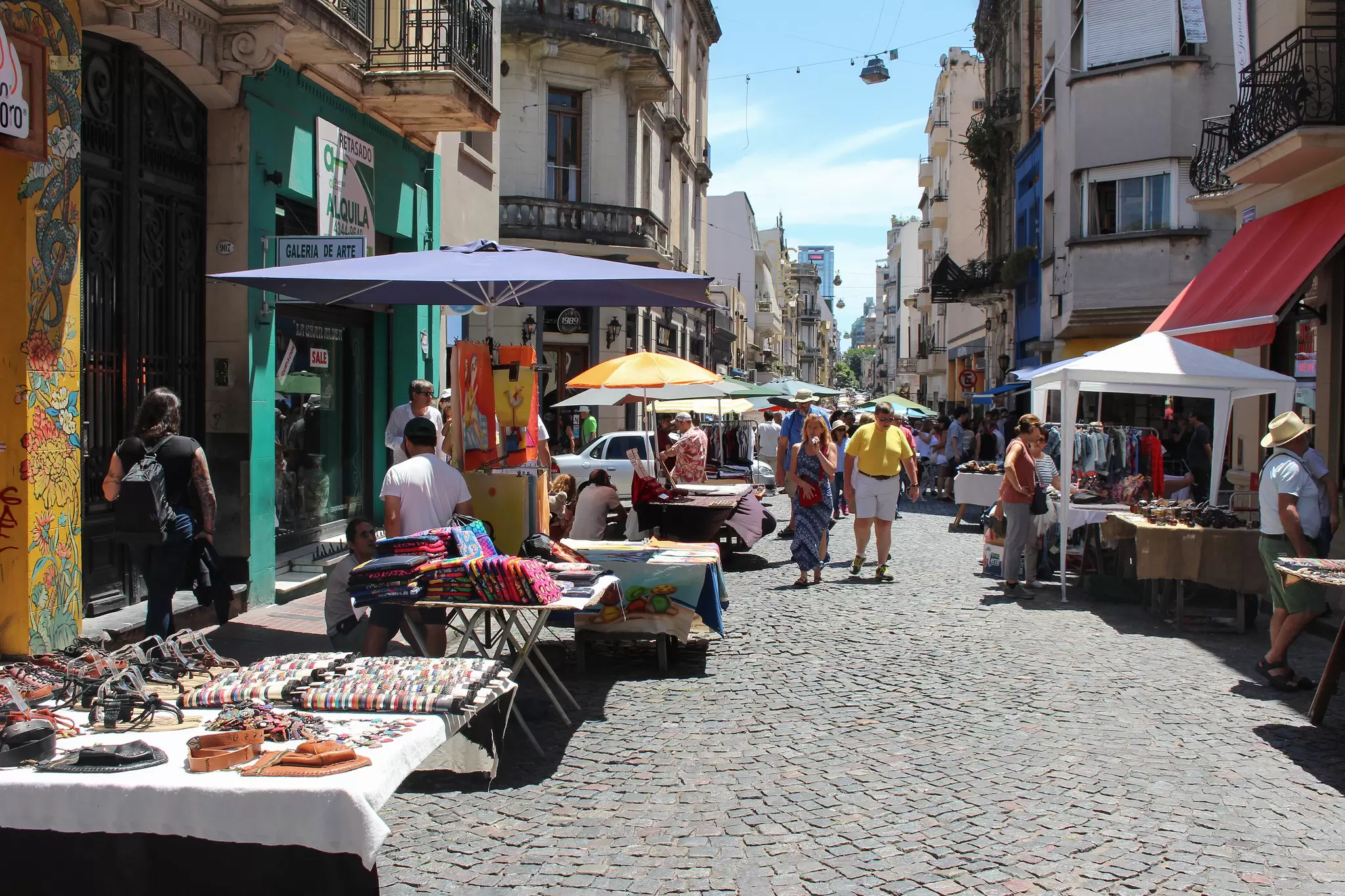 People peruse the stalls at the Feria de San Telmo held on Sundays in Buenos Aires, Argentina.