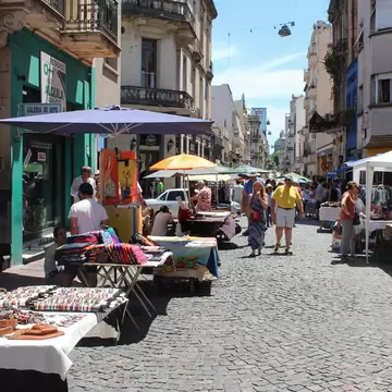 Visitors pass stalls at Feria de San Telmo in Buenos Aires, Argentina.
