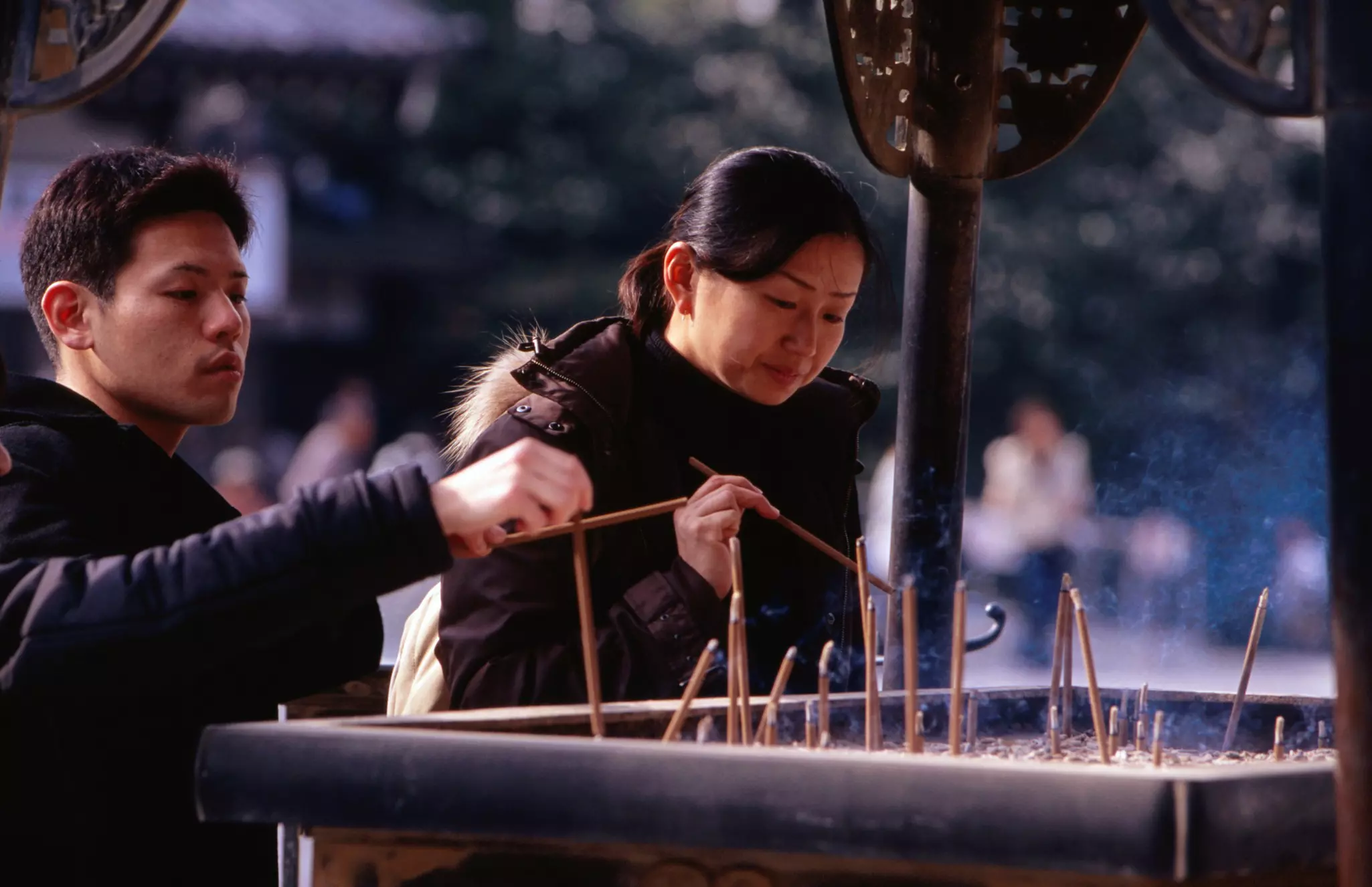 People burning incense at main temple, Chion-in.