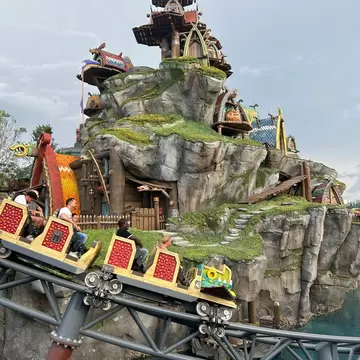 View of people on the Hiccup’s Wing Gliders ride at Universal Epic Universe in Orlando, Florida.