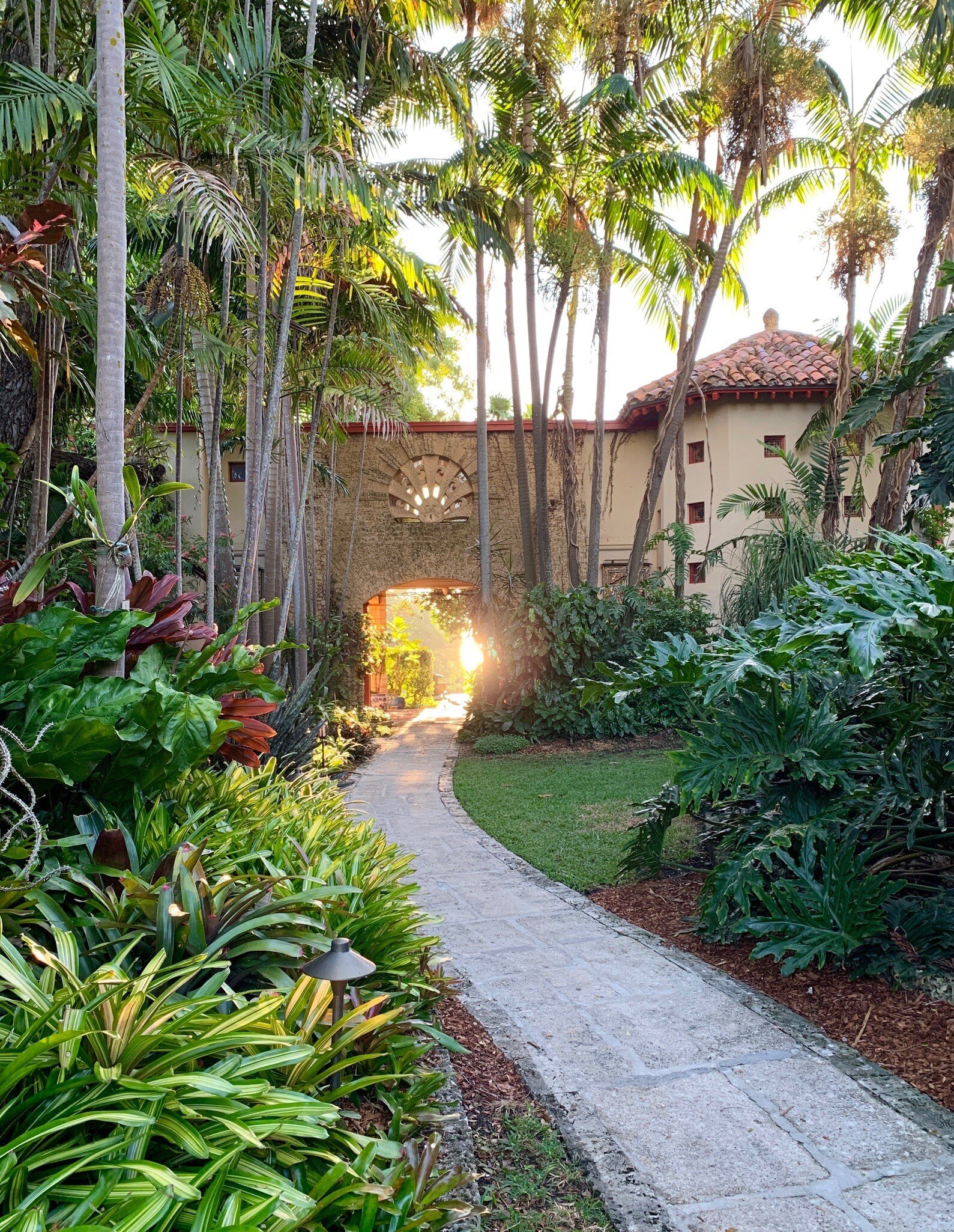 View of a path in the Kampong, one of the five gardens that make up the National Tropical Botanical Garden in Miami, Florida.