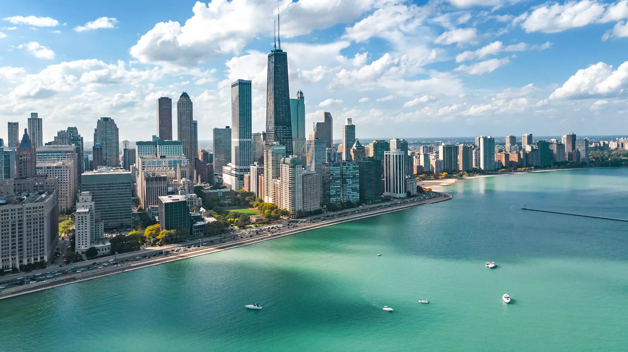 A view of boats in Lake Michigan and the towers of the Chicago skyline.