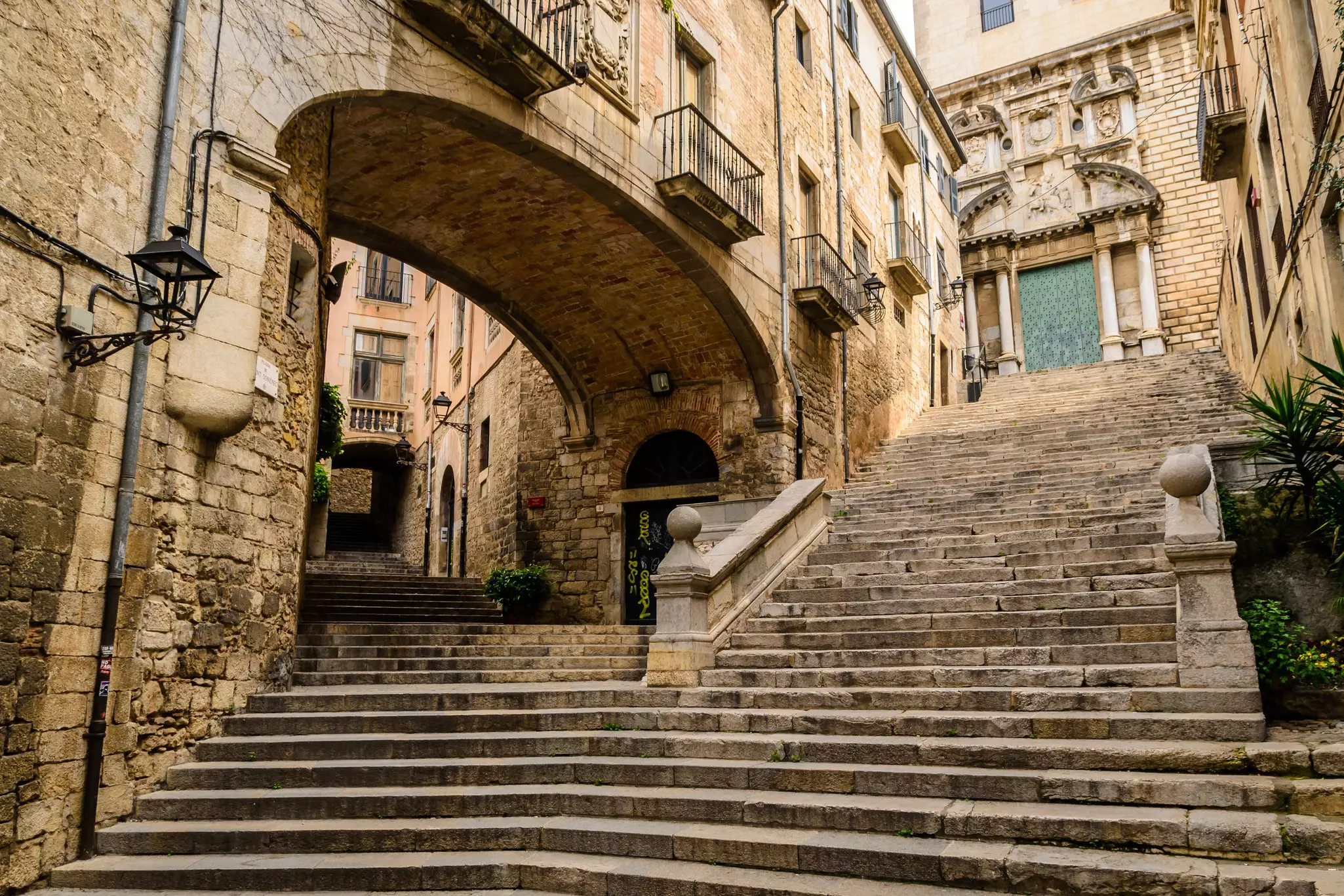 Steps and old buildings in the old city of Girona, Spain, with no people.