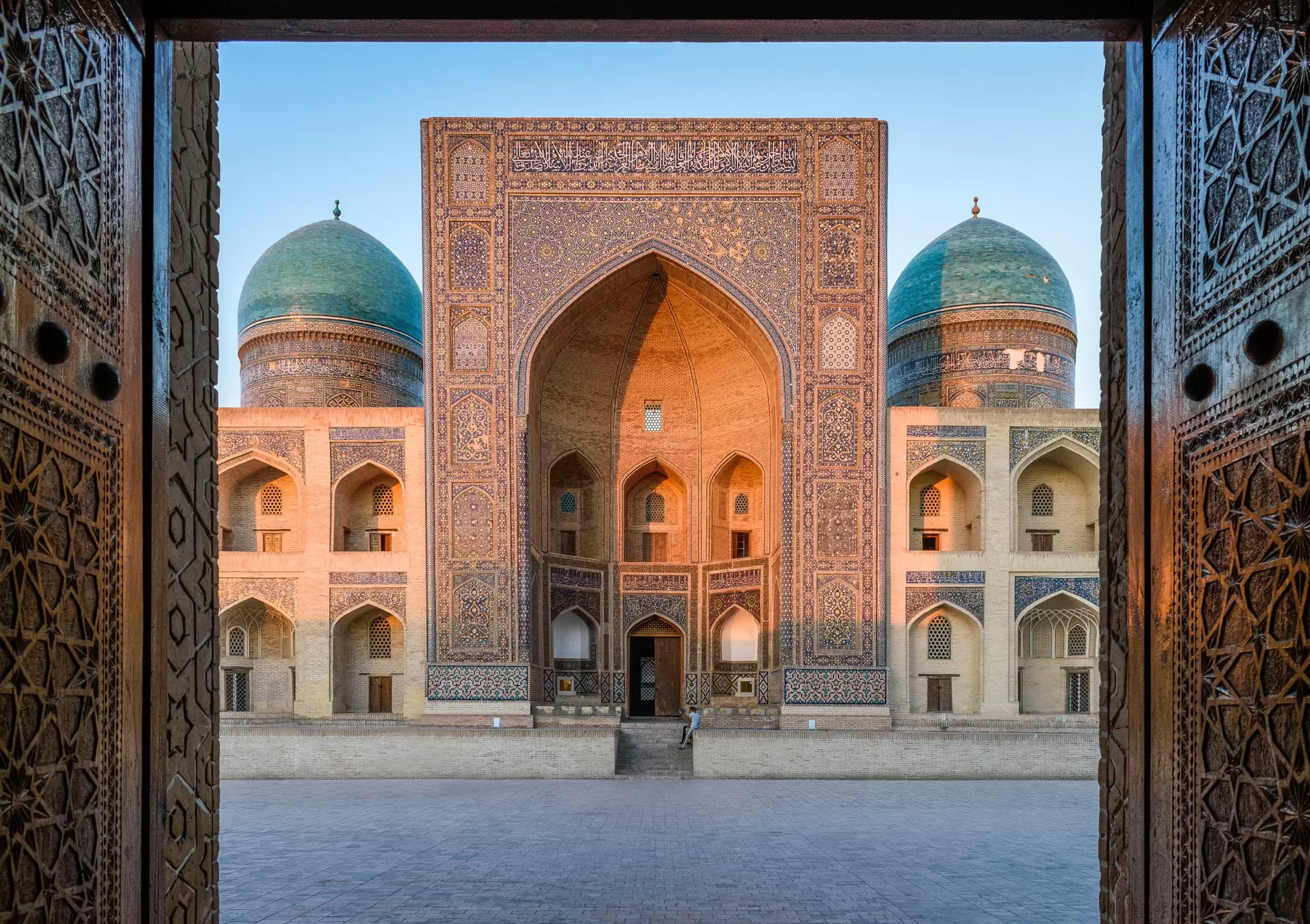 GettyImages-1124778929.jpg
View into the courtyard and the decorated arch and minarets of a Madrasa or mosque in Bukhara city centre.