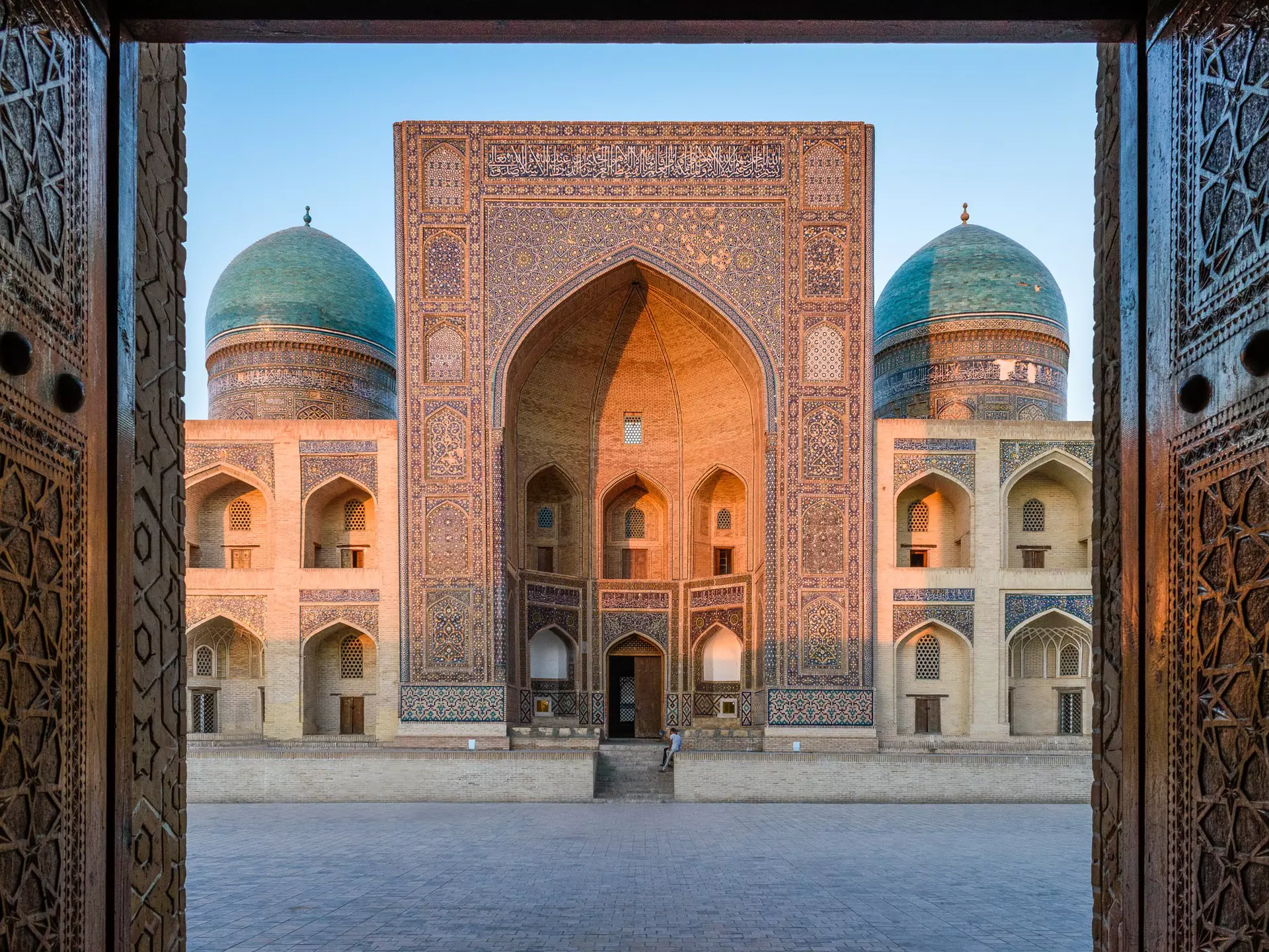 GettyImages-1124778929.jpg
View into the courtyard and the decorated arch and minarets of a Madrasa or mosque in Bukhara city centre.