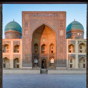 GettyImages-1124778929.jpg
View into the courtyard and the decorated arch and minarets of a Madrasa or mosque in Bukhara city centre.