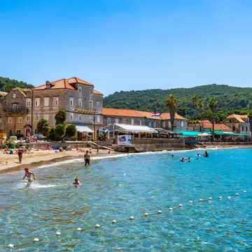 Vacationers enjoying the clear waters on Lopud