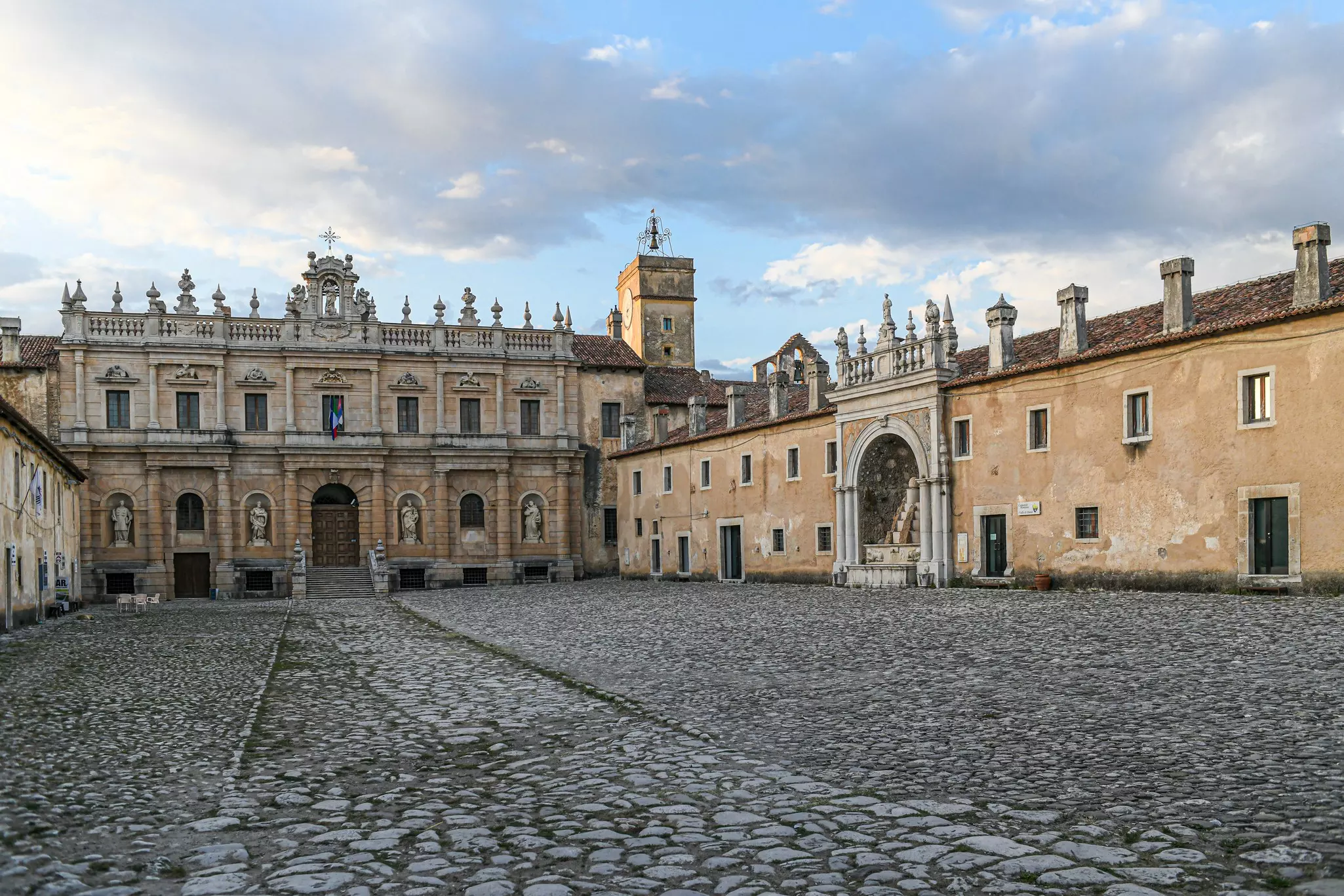 Cobbled courtyard inside a historic monastery in Italy