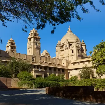 Facade of Umaid Bhawan Palace from the garden, Jodhpur, India.