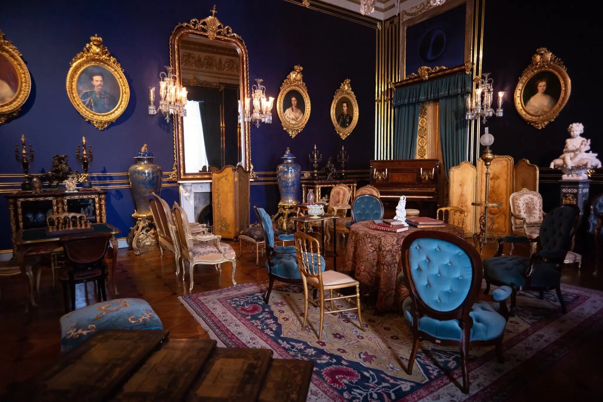View of a richly decorated room in the Palácio Nacional da Ajuda in Lisbon, Portugal.