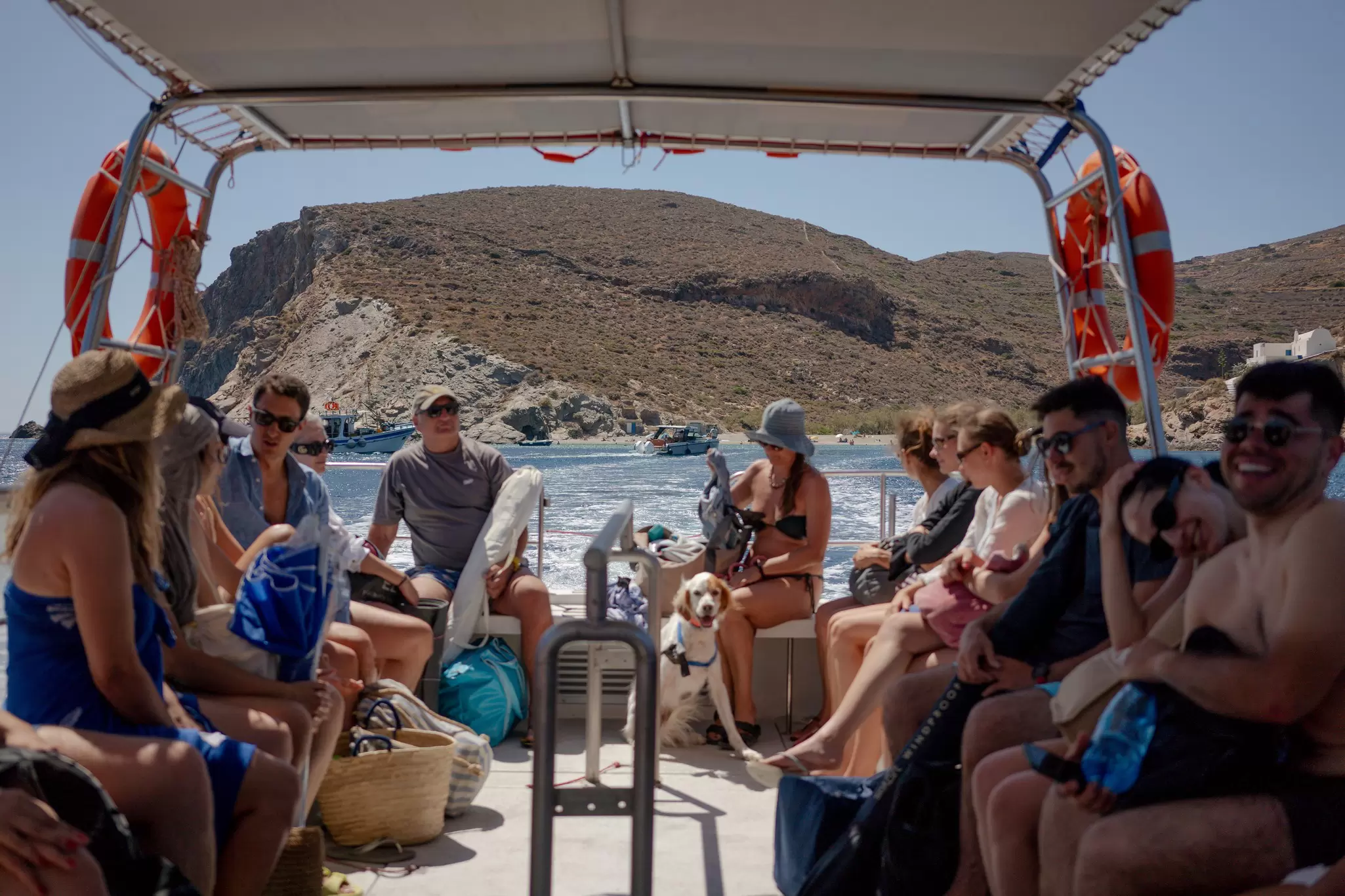 People on a boat from Paralia Agios Nikoloas on Folegandros Island, Greece