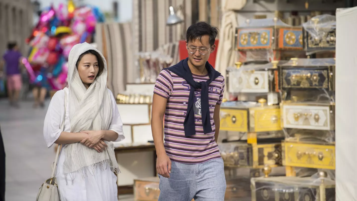 Tourists tour the old market of Souk Waqif, Doha, Qatar, Middle East