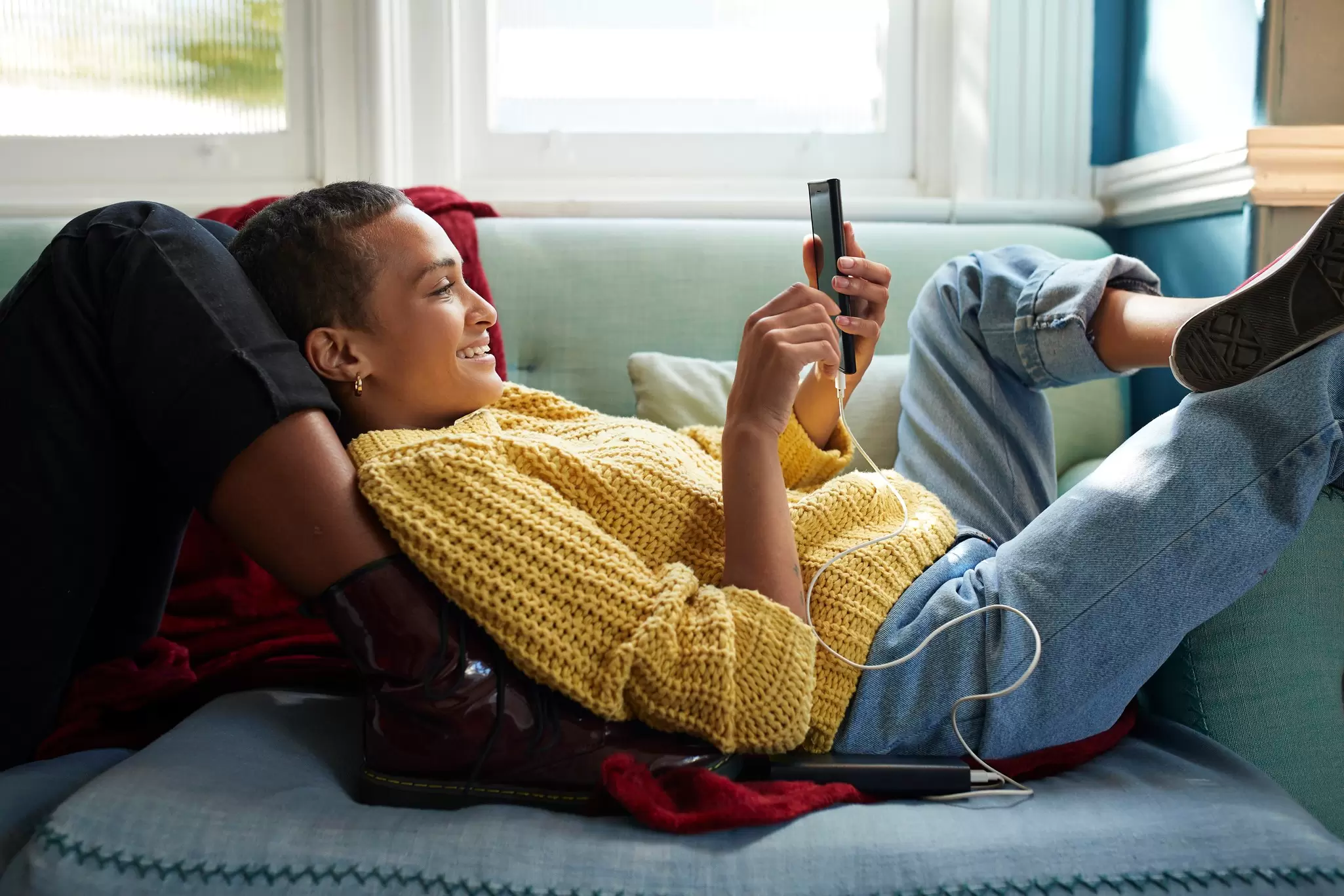 A traveler using a smartphone travel app