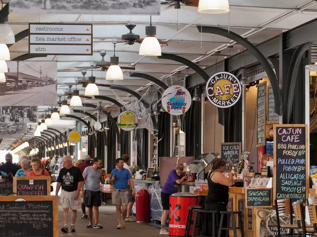 People dining in and strolling through the French Market.