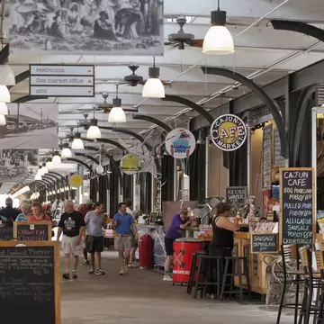People dining in and strolling through the French Market.