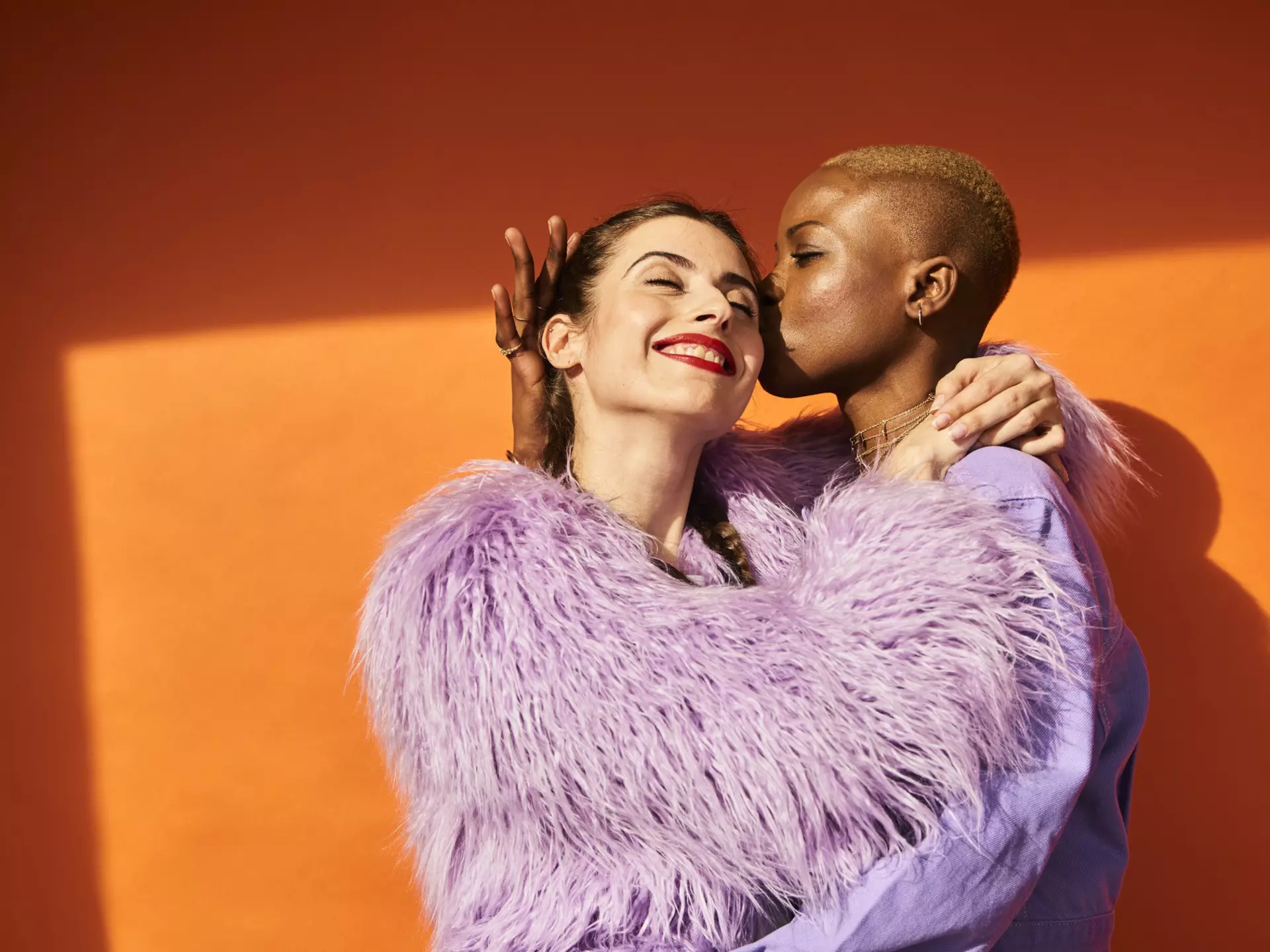 Colourful studio portrait of one woman kissing another woman's cheek.
1146893302
People, Carefree, Enjoyment, Embracing, Confidence, Dating, Connection, Two People, Love - Emotion, Multi-Ethnic Group, Femininity, Orange Color, Friendship, Affectionate, Diversity, Horizontal, Only Women, Adults Only, Girlfriend, Celebration, Young Adult, EC08, LGBTQI Rights, Purple, Homosexual Couple, UberFinanceCode2019, Color Image, Young Women, Women, African Ethnicity, Caucasian Ethnicity, Orange Background, Real People, Young Couple, Lesbian, Lilac, Bonding, LGBTQI People, Photography, Beautiful Woman, Positive Emotion, Beautiful People, Beauty, Mixed, 25-29 Years, Playful, Romance, Studio Shot, Touching, Couple - Relationship, Politics and Government, Sensuality, Individuality, Portrait, Contrasts, Homosexual, Colored Background, Adult, UK, Copy Space