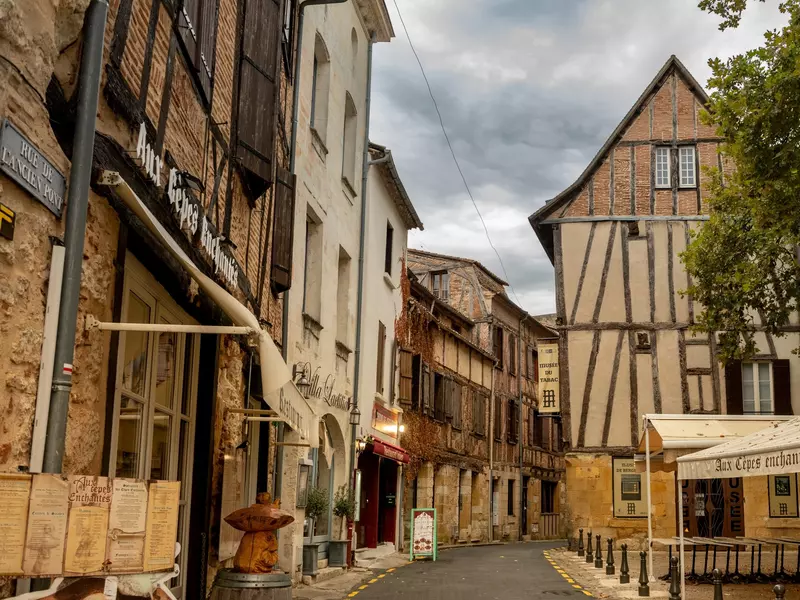 A medieval French village with half-timbered buildings turned into shops and restaurants